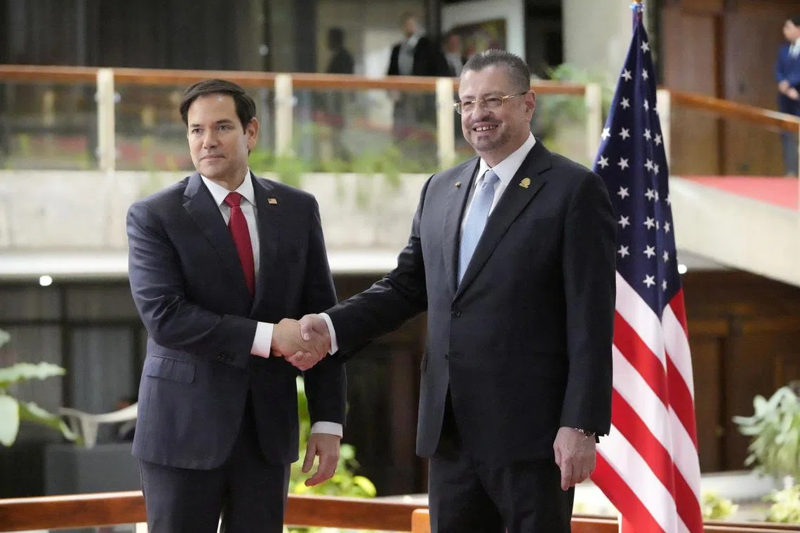 FILE PHOTO: U.S. Secretary of State Marco Rubio shakes hands with Costa Rican President Rodrigo Chaves during a joint news conference at the presidential palace in San Jose, Costa Rica, Feb. 4, 2025.  Mark Schiefelbein/Pool via REUTERS/File Photo
