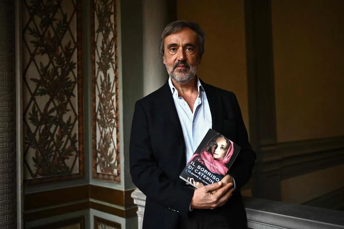 Italian writer Carlo Vecce holds a copy of his book Il Sorriso Di Caterina Madre Di Leonardo (The Smile Of Caterina, The Mother Of Leonardo) in Villa La Loggia in Florence, on March 14, 2023. 
