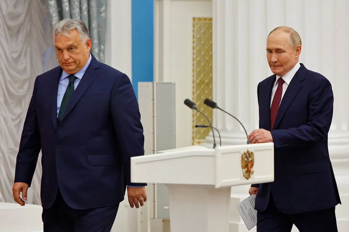 Hungary's Prime Minister Viktor Orban and Russia's President Vladimir Putin arrive for a press conference following their meeting in Moscow, Russia July 5, 2024. REUTERS/Evgenia Novozhenina