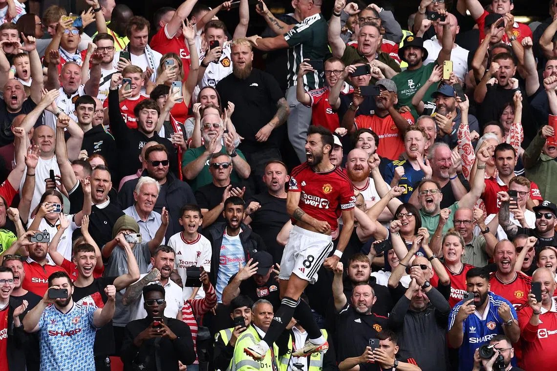 Manchester United's Bruno Fernandes celebrates after scoring his team's third goal.