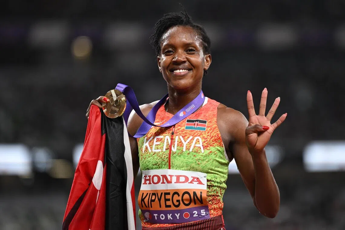 Faith Kipyegon of Kenya celebrates after winning the women's 1,500m final at the World Athletics Championships.