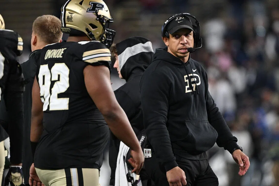 FILE PHOTO: Nov 16, 2024; West Lafayette, Indiana, USA;  Purdue Boilermakers head coach Ryan Walters looks at defensive lineman Mo Omonode (92) while in a timeout during the second half against the Penn State Nittany Lions at Ross-Ade Stadium. Marc Lebryk-Imagn Images/File Photo