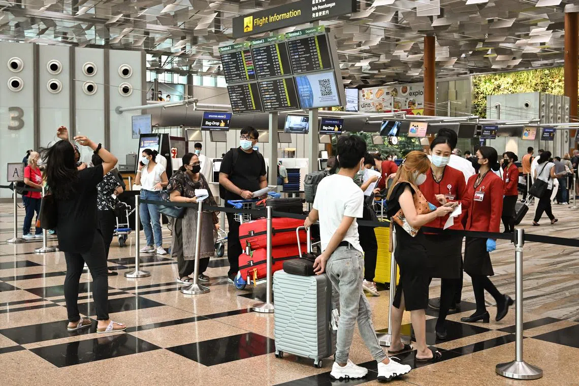 Passengers at the departure hall of Changi Airport Terminal 3 on Apr 26, 2022.
