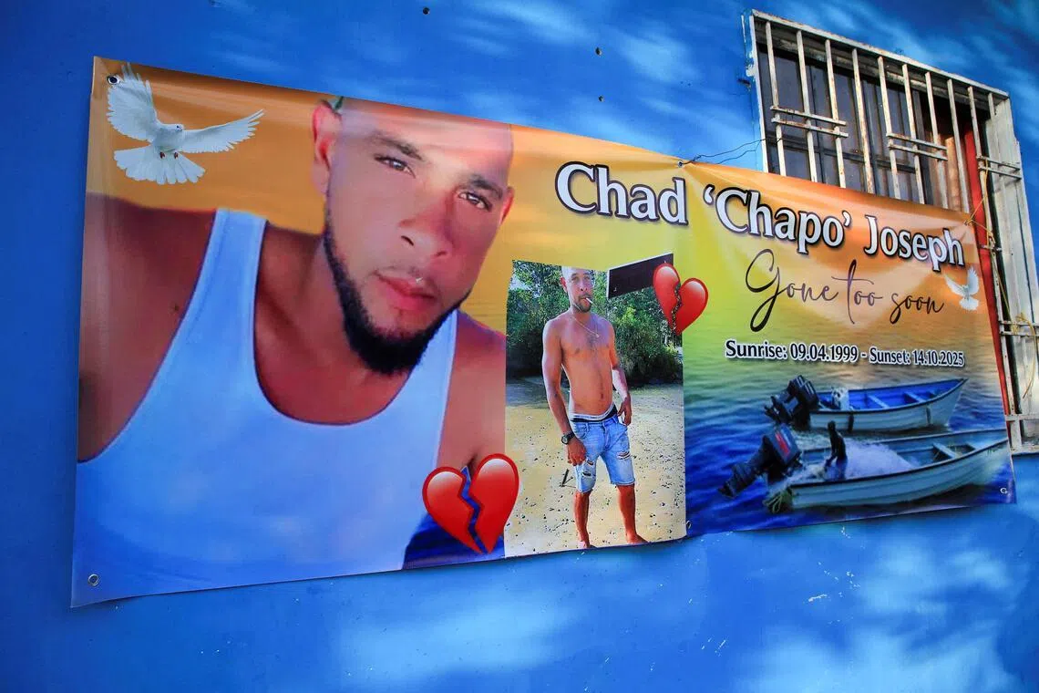 A banner hanging outside the family home of Chad Joseph, - a victim of US missile strikes on vessels off Venezuela.
