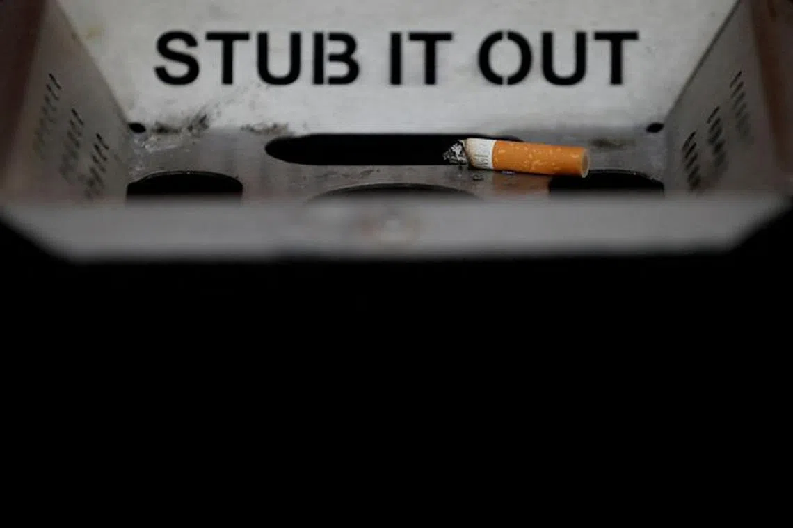 FILE PHOTO: A cigarette stub is seen in an ashtray on a street in Liverpool , northern England October 17 , 2016. REUTERS/Phil Noble/File Photo