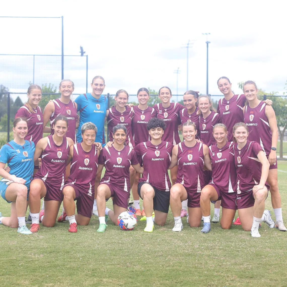 Iranian soccer players Atefeh Ramezanizadeh and Fatemeh Pasandideh pose for a photo with members of Brisbane Roar women's football club, in Brisbane, Australia, March 16, 2026. Brisbane Roar/Handout via REUTERS