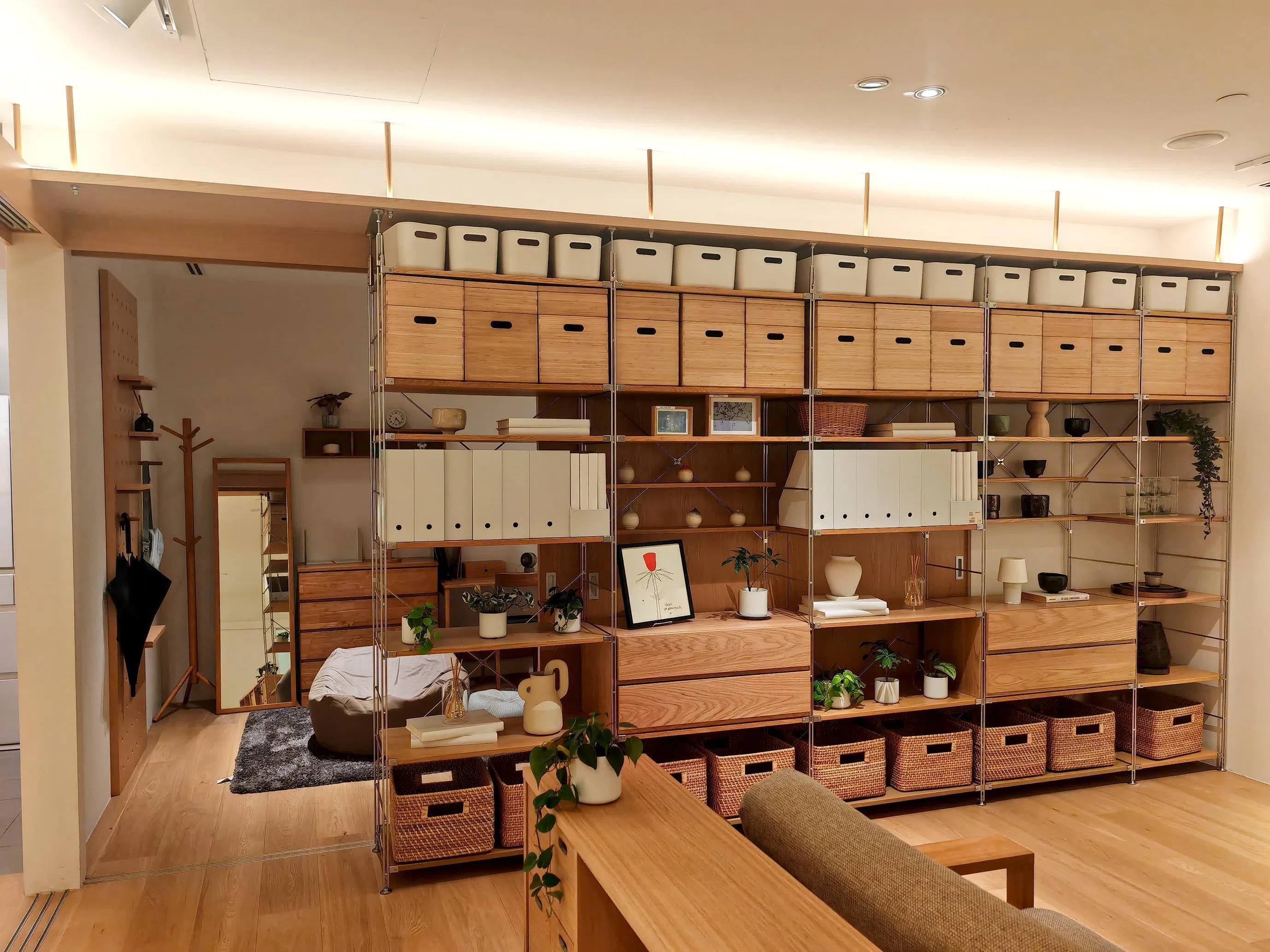 Muji’s stainless steel shelf units can be used as modular dividers that also serve as storage areas.