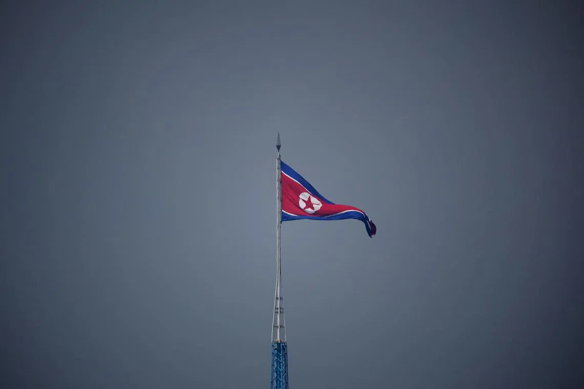 FILE PHOTO: A North Korean flag flutters at the propaganda village of Gijungdong in North Korea, in this picture taken near the truce village of Panmunjom inside the demilitarized zone (DMZ) separating the two Koreas, South Korea, July 19, 2022.  REUTERS/Kim Hong-Ji/Pool/File Photo
