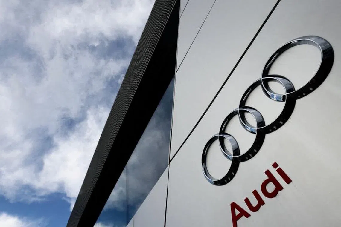 FILE PHOTO: A logo of Audi is seen outside an Audi car dealer in Brussels, Belgium March 13, 2023. REUTERS/Yves Herman/File Photo
