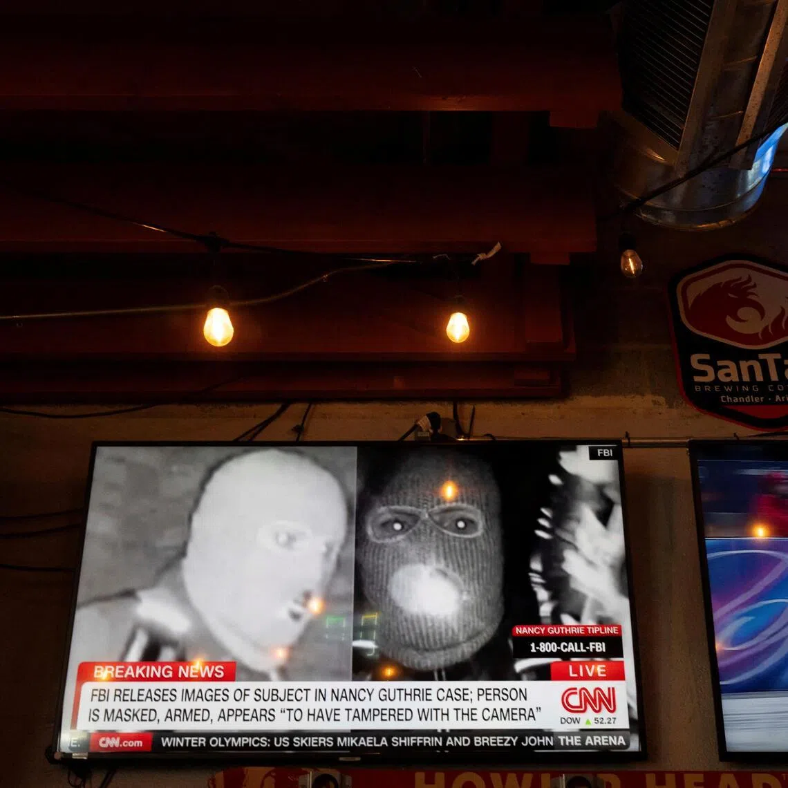 The photos released by US officials show a person wearing a face mask, gloves, backpack and what appears to be a gun holster.