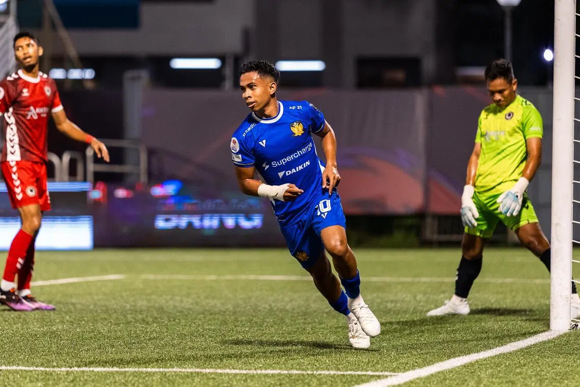 Hougang United winger Farhan Zulkifli wheels away to celebrate after scoring the opening goal in their 3-2 Singapore Cup group win over Tanjong Pagar United as goalkeeper Kenji Rusydi and defender Faizal Roslan look on in disappointment.