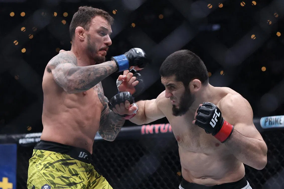 Renato Moicano of Brazil and Islam Makhachev of Russia fight in a lightweight title fight during UFC 311 at Intuit Dome on Jan 18 in Inglewood, California. Makhachev triumphed via a first-round submission.
