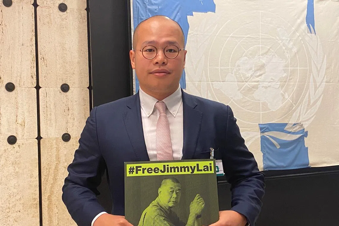 Mr Sebastien Lai holds a sign calling for the release of his father on the sidelines of the United Nations Human Rights Council in Geneva, Switzerland, on Sept 27, 2023. 
