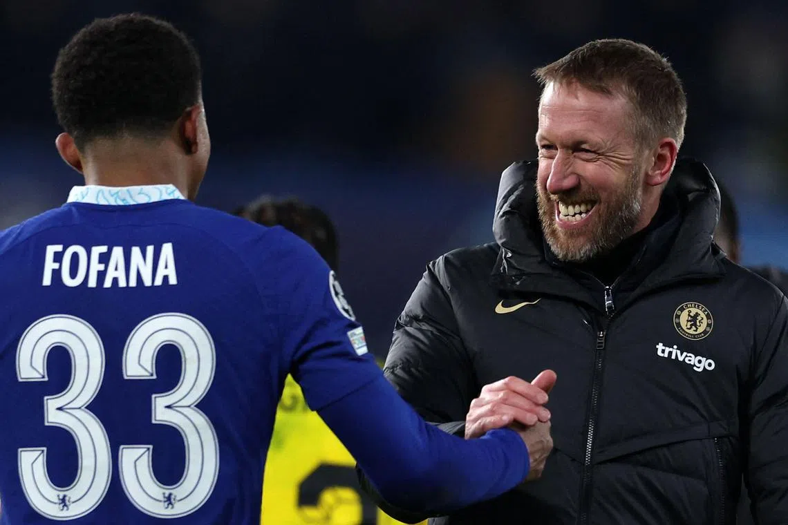 Chelsea manager Graham Potter celebrates with Wesley Fofana after Champions League win over Borussia Dortmund.