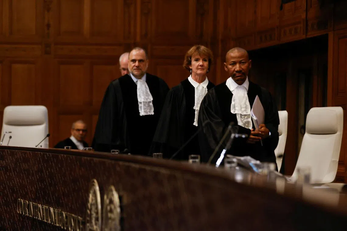 Judges arrive at the International Court of Justice (ICJ), during a ruling on South Africa's request to order a halt to Israel's Rafah offensive in Gaza as part of a larger case brought before the Hague-based court by South Africa accusing Israel of genocide, in The Hague, Netherlands May 24, 2024. REUTERS/Johanna Geron