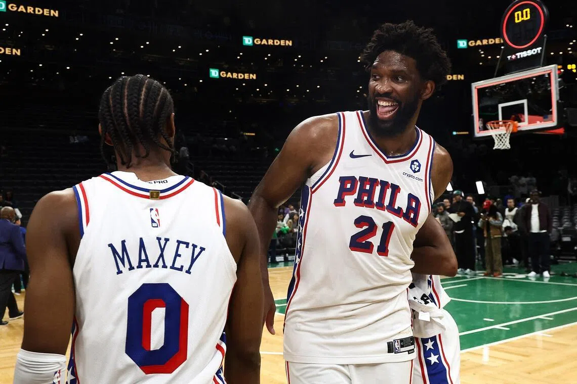 Philadelphia 76ers centre Joel Embiid celebrating with guard Tyrese Maxey after their 109-100 Game 7 victory over the Boston Celtics in their NBA Eastern Conference first-round series at TD Garden in Boston on May 2, 2026.
