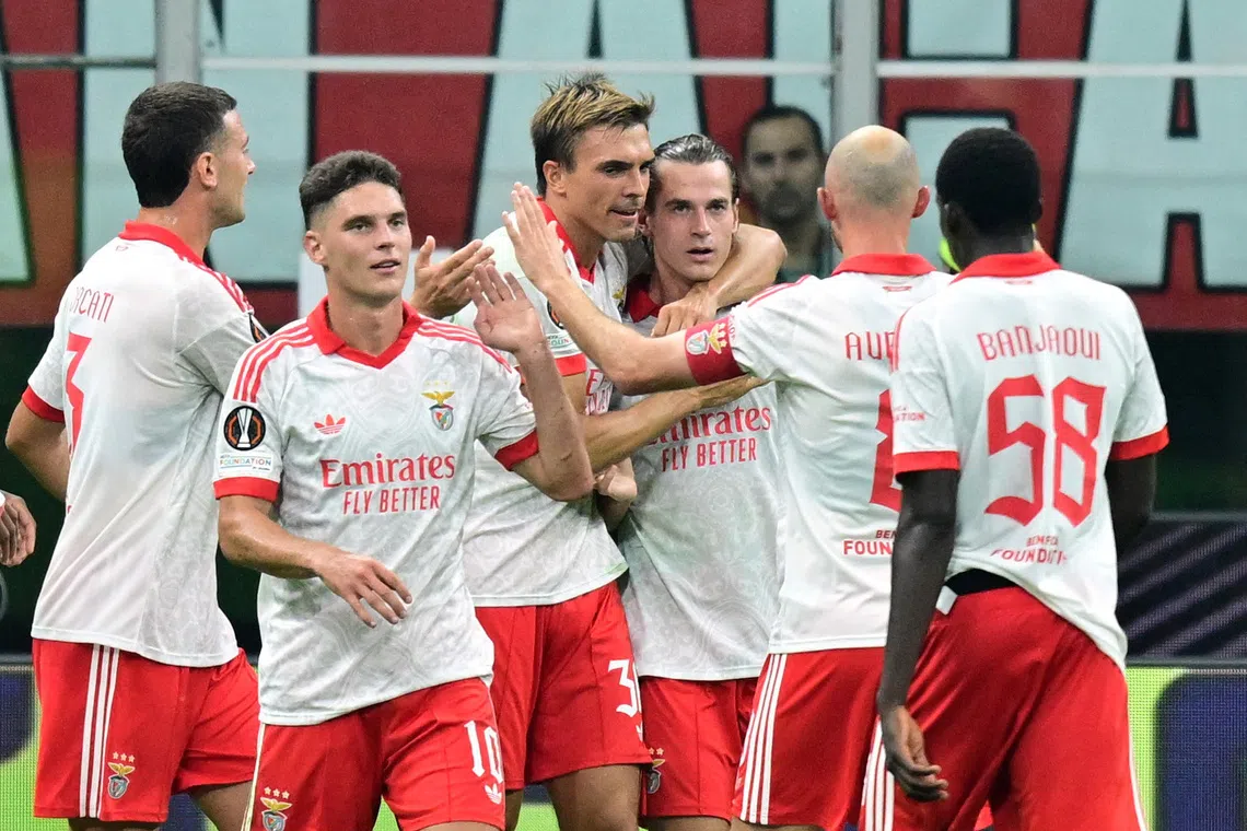 Soccer Football - UEFA Europa League - AC Milan v Benfica - San Siro, Milan, Italy - September 16, 2026 Benfica's Jakub Kaminski celebrates scoring their second goal with teammates REUTERS/Daniele Mascolo