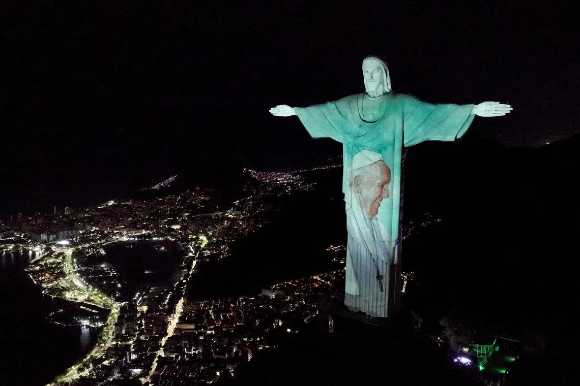 A picture of Pope Francis projected on Christ the Redeemer statue in Rio de Janeiro, Brazil, on Feb 27, 2025. Pope Francis's condition was continuing to improve, as the 88-year-old pontiff marked two weeks in hospital with pneumonia in both lungs. 