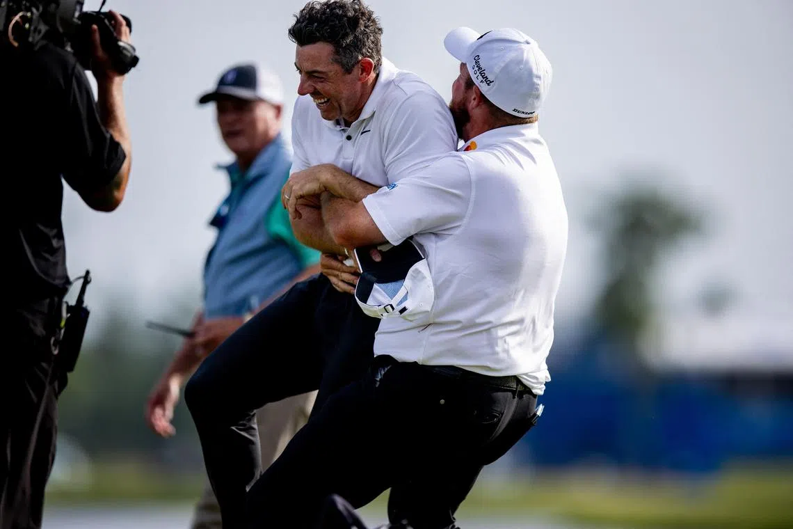 Shane Lowry (right) hugging Rory McIlroy after they won the PGA Zurich Classic of New Orleans golf tournament on April 28 at TPC Louisiana in Avondale.