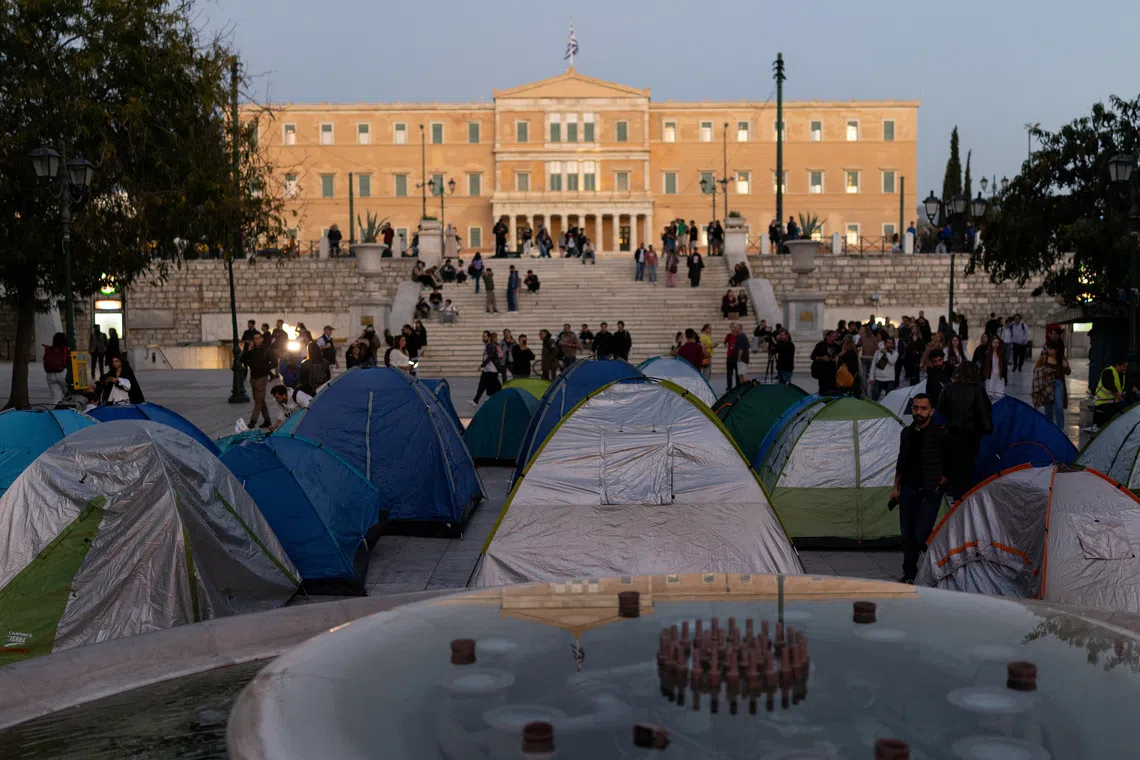 Tents are set up in Syntagma Square in front of the Greek Parliament during an overnight protest against rising housing costs and underfunded education, in solidarity with students in France and Spain, in Athens, Greece, October 20, 2026. REUTERS/Stelios Misinas