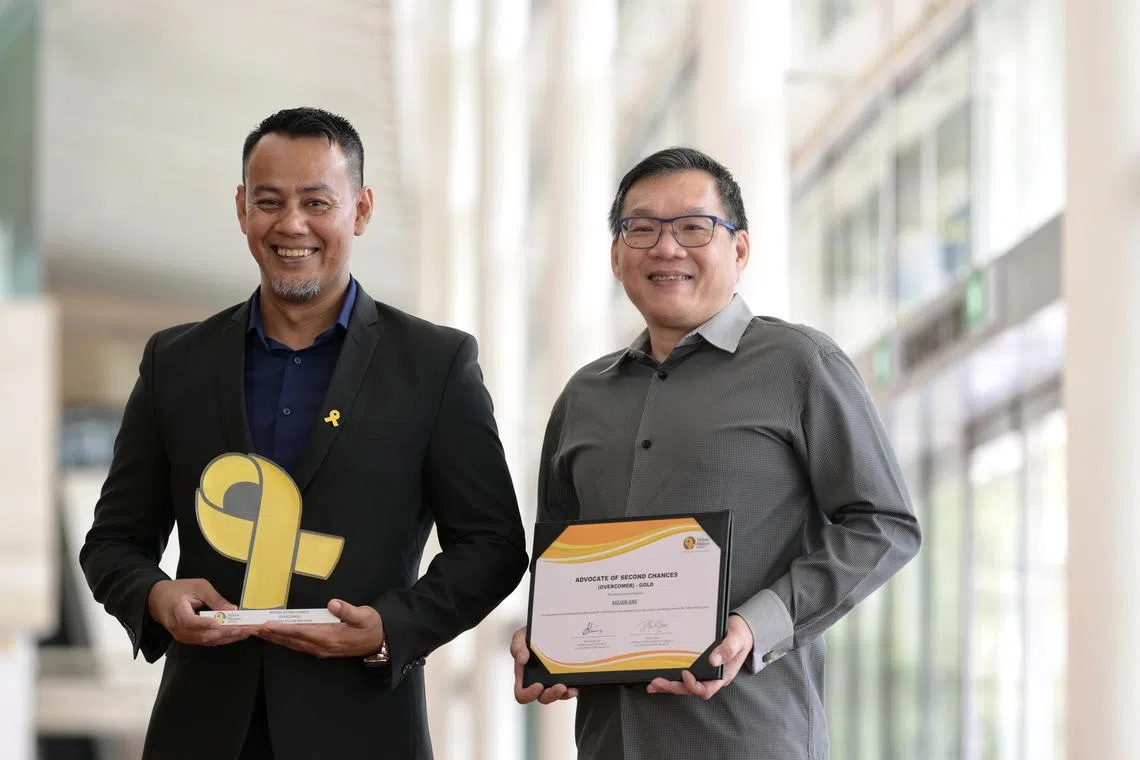Mr Nelson Ong (left), Senior Manager (Skills@YR), Yellow Ribbon Singapore and recipient of Advocates of Second Chances and Dr Mohammad Riduan Ishak, Executive Director, Tarkiz Pte Ltd and recipient of Beyond Second Chances.