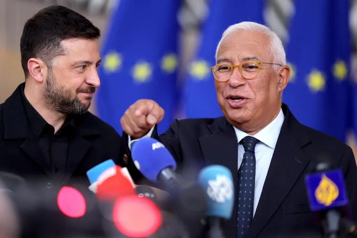 Ukrainian President Volodymyr Zelensky (left) and European Council president Antonio Costa answering media questions as they arrive for the Euro Summit in Brussels, Belgium, on Oct 23.
