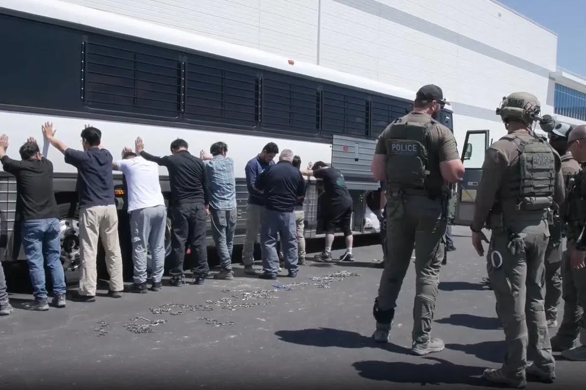 This screen grab from a handout video distributed by the US Immigration and Customs Enforcement shows federal agents executing an enforcement operation at a Hyundai-LG electric vehicle battery plant in Ellabell, Georgia, on Sept 4, 2025.