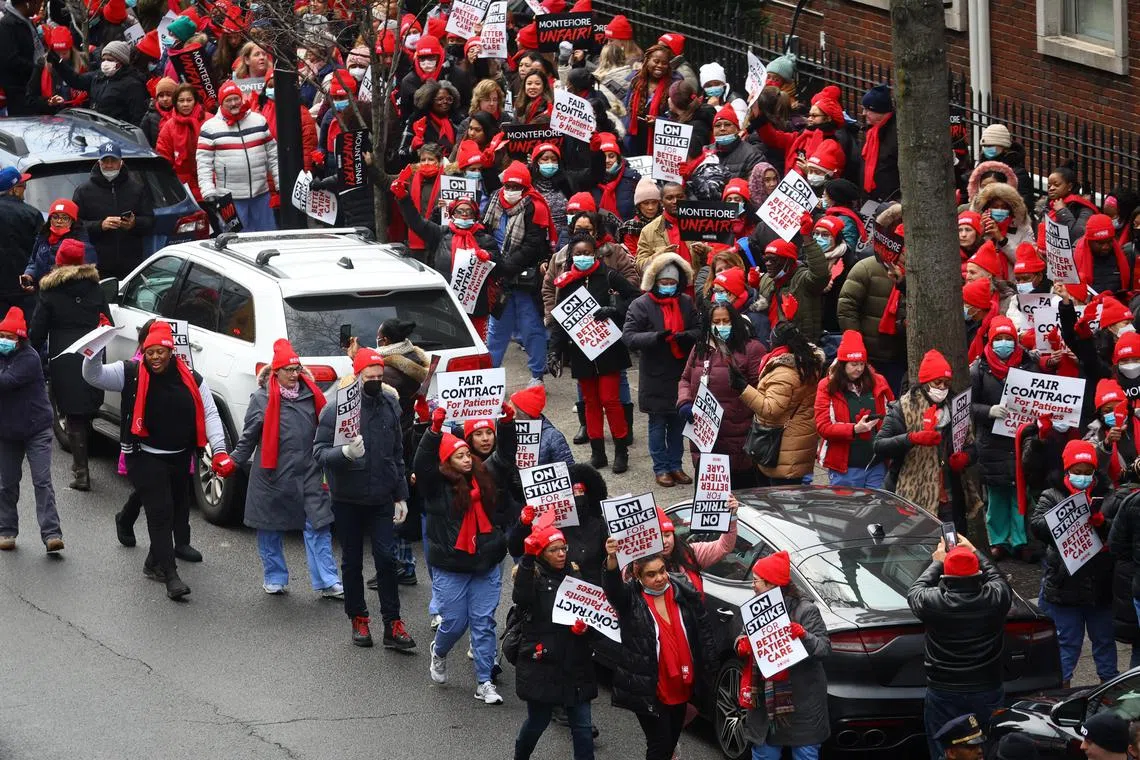 Striking union nurses from the New York State Nurses Association (NYSNA) walk the picket line outside Montefiore Hospital in the Bronx borough of New York City, US on Jan 9, 2023.