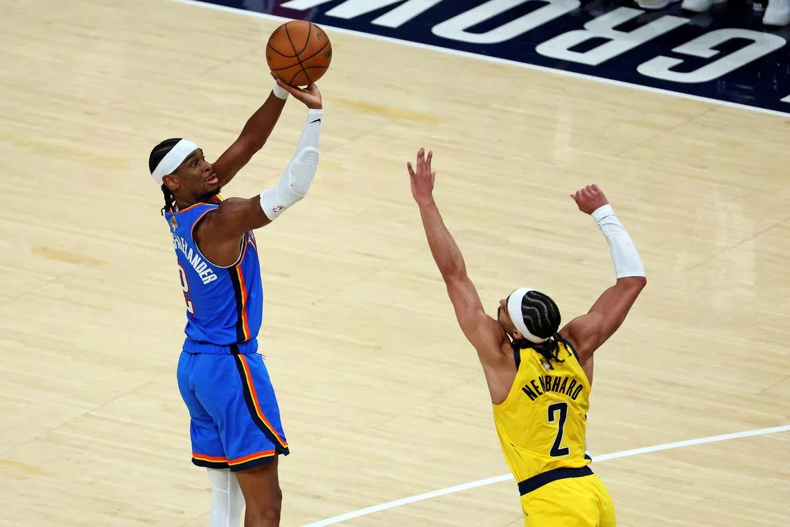 Jun 11, 2025; Indianapolis, Indiana, USA; Oklahoma City Thunder guard Shai Gilgeous-Alexander (2) shoots the ball against Indiana Pacers guard Andrew Nembhard (2) during the fourth quarter in game three of the 2025 NBA Finals at Gainbridge Fieldhouse. Mandatory Credit: Trevor Ruszkowski-Imagn Images