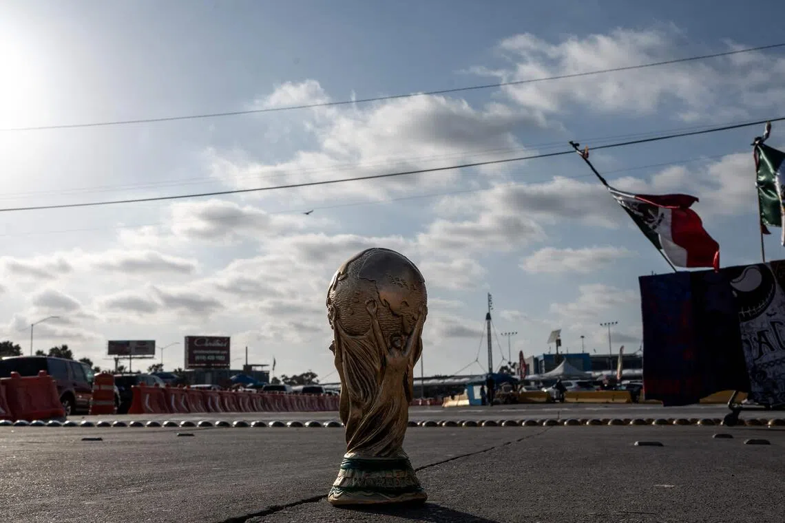 A World Cup trophy souvenir is pictured on a street in Tijuana, Baja California state, Mexico on May 23, 2026. Iran are moving their World Cup training base to Tijuana, Mexico, after football's world governing body FIFA approved a request to transfer it from Tucson, Arizona, the head of Iran's football federation Mehdi Taj said on May 23, 2026.