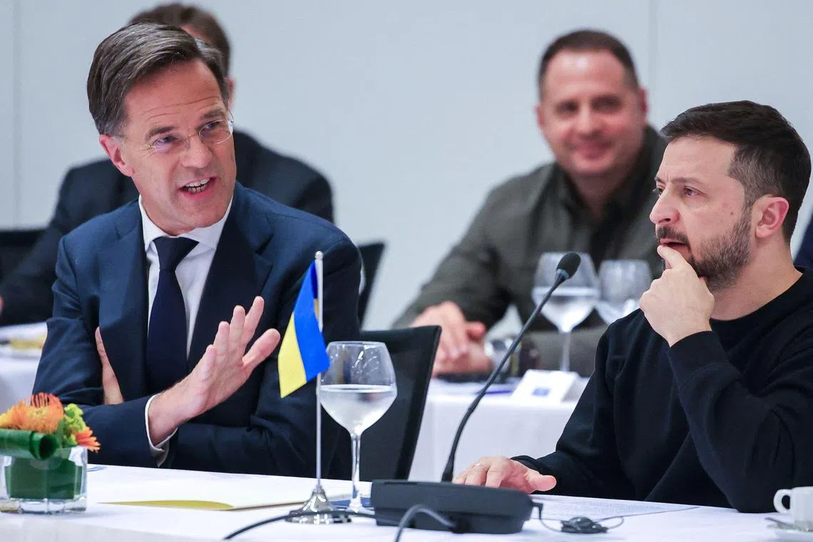 Nato Secretary General Mark Rutte (left) and Ukraine's President Volodymyr Zelensky (right) during a Nato-Ukraine Council Working Dinner at the Nato headquarters in Brussels on Oct 17, 2024.