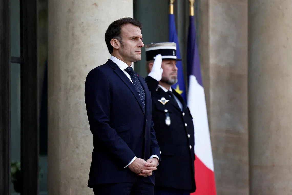 FILE PHOTO: French President Emmanuel Macron waits for the arrival of European leaders for a meeting on Ukraine and European security at the Elysee Palace in Paris, France, February 17, 2025. REUTERS/Abdul Saboor/File Photo