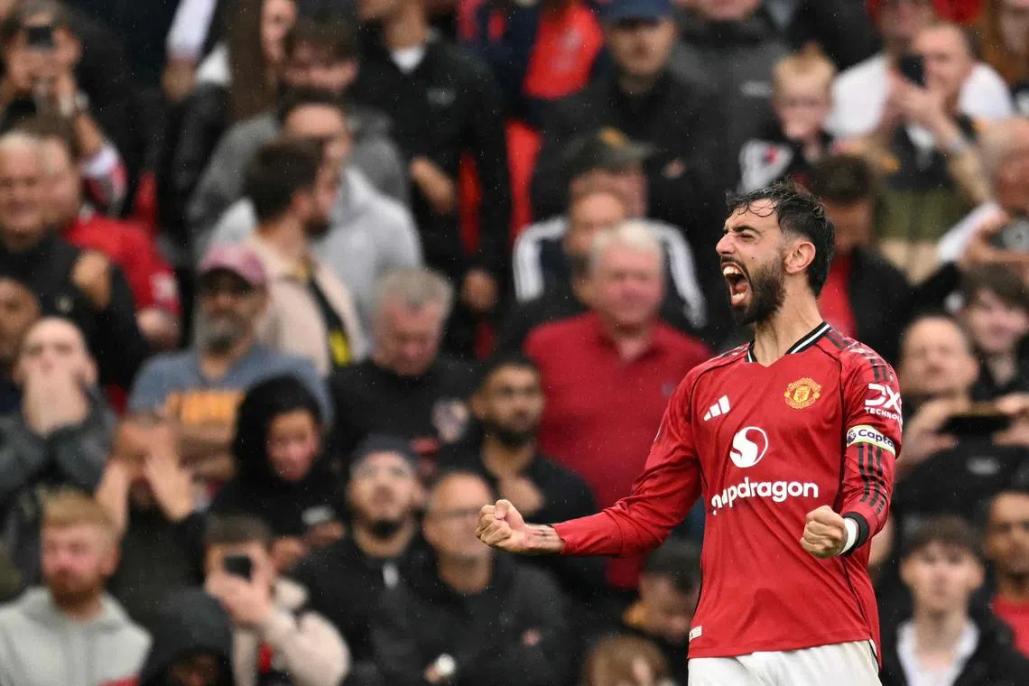 Manchester United's Portuguese midfielder Bruno Fernandes celebrating after scoring the winner from the penalty spot during the 3-2 English Premier League triumph over Burnley at Old Trafford on Aug 30, 2025.