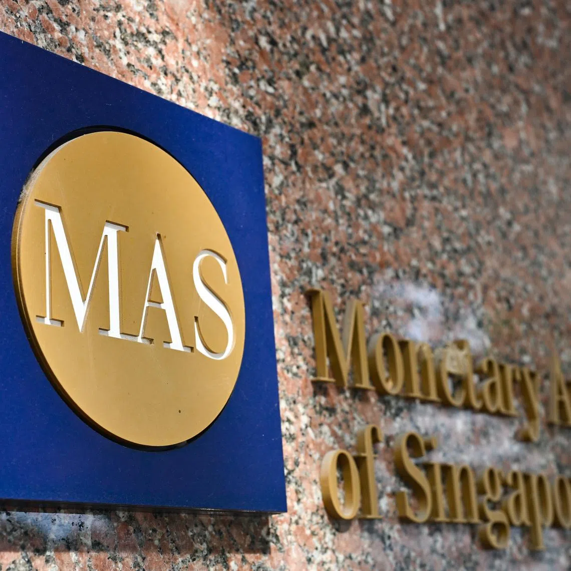 ST20250721-202565000300-Lim Yaohui-Benjamin Lim-bnmas21/ Generic photograph of MAS logo outside Monetary Authority of Singapore (MAS) building at 10 Shenton Way on July 21, 2025. The Monetary Authority of Singapore (MAS) is Singapore’s central bank and integrated financial regulator. As central bank, MAS promotes sustainable, non-inflationary economic growth through the conduct of monetary policy and close macroeconomic surveillance and analysis. It manages Singapore’s exchange rate, official foreign reserves, and liquidity in the banking sector. As an integrated financial supervisor, MAS fosters a sound financial services sector through its prudential oversight of all financial institutions in Singapore – banks, insurers, capital market intermediaries, financial advisors, and stock exchanges. It is also responsible for well-functioning financial markets, sound conduct, and investor education. MAS also works with the financial industry to promote Singapore as a dynamic international financial centre. It facilitates the development of infrastructure, adoption of technology, and upgrading of skills in the financial industry. 