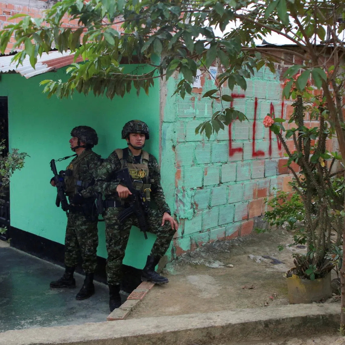 Colombian soldiers stand guard in the municipality of El Tarra, Colombia February 4, 2025. REUTERS/Carlos Eduardo Ramirez/File Photo
