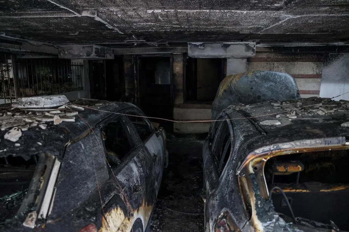 Burned out cars, after attackers firebombed three residential buildings linked to Greece's governing party in the northern city of Thessaloniki, Greece, July 1, 2026. REUTERS/Alexandros Avramidis