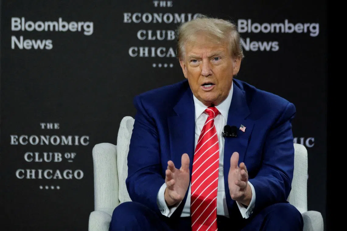 FILE PHOTO: Republican presidential nominee and former U.S. President Donald Trump speaks as he is interviewed by Bloomberg Editor-in-Chief John Micklethwait at the Economic Club of Chicago in Chicago, Illinois, U.S. October 15, 2024.  REUTERS/Joel Angel Juarez/File Photo