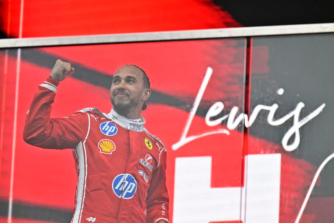 Second-placed Lewis Hamilton of Ferrari celebrates on the podium after the Canadian Grand Prix.