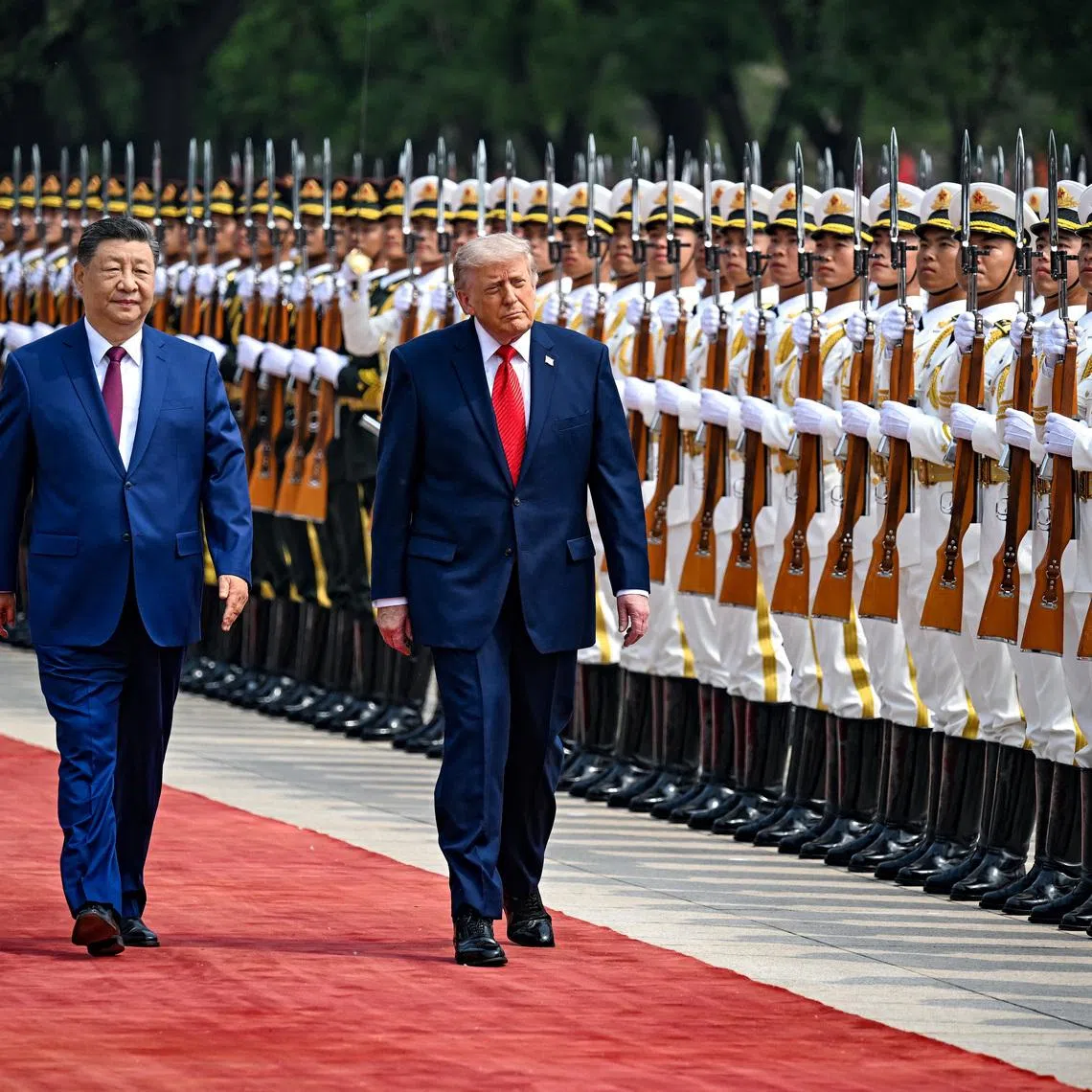 U.S. President Donald Trump reviews the troops with the President of the People’s Republic of China Xi Jinping, in Beijing, China, May 14, 2026, during a trip focused on trade, regional security, and strengthening bilateral ties between the world’s two largest economies. Kenny Holston/Pool via REUTERS