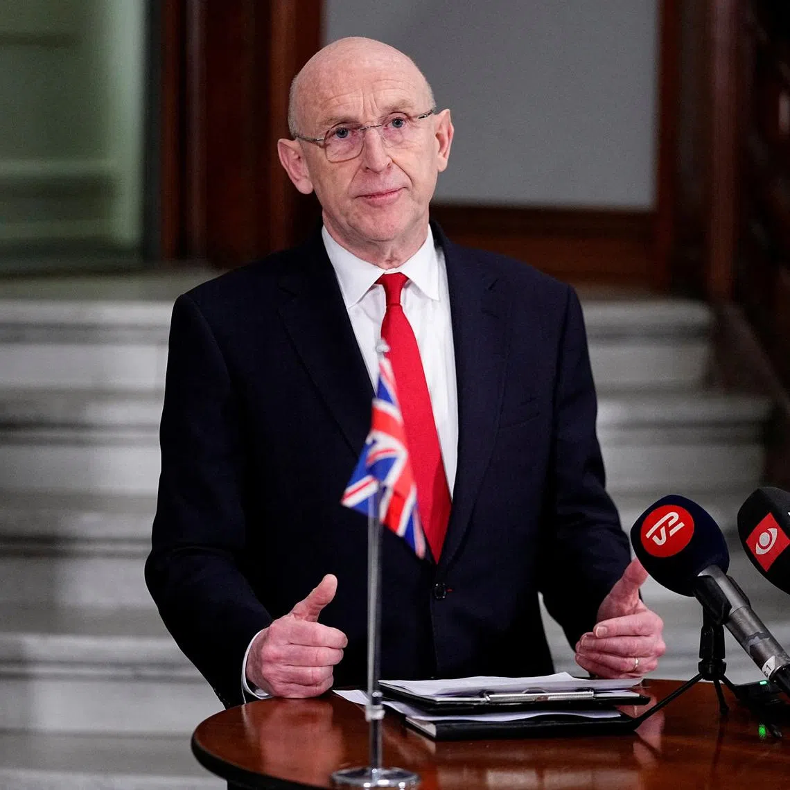 FILE PHOTO: British Defense Minister John Healey and Danish Defense Minister Troels Lund Poulsen (not pcitured) attend a press conference at the Ministry of Defense in Copenhagen, January 21, 2026. Thomas Traasdahl/Ritzau Scanpix/via REUTERS/File Photo