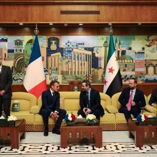 France’s President Emmanuel Macron (second left) speaks with Syria’s Foreign Minister Asaad al-Shaibani (centre right) during a bilateral meeting in Damascus.
