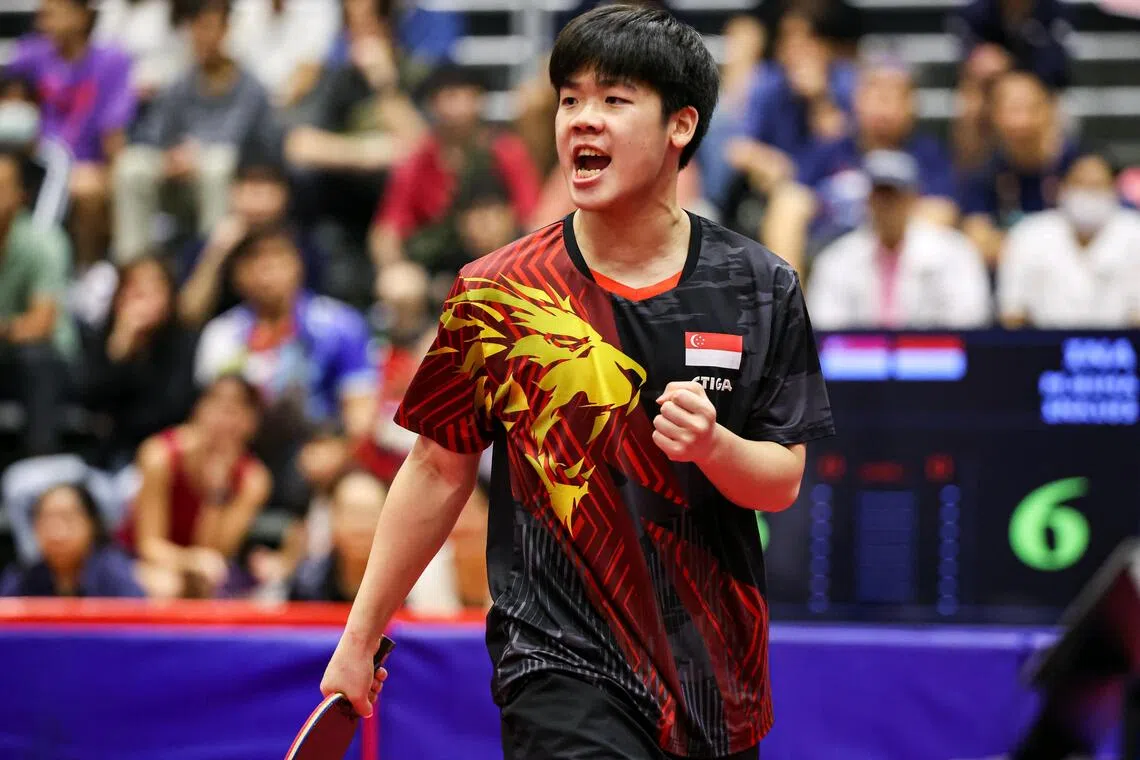 Singapore's Izaac Quek celebrating after scoring a point against Indonesia's Bima Abdi Negara in the men's singles final at the SEA Games on Dec 19.