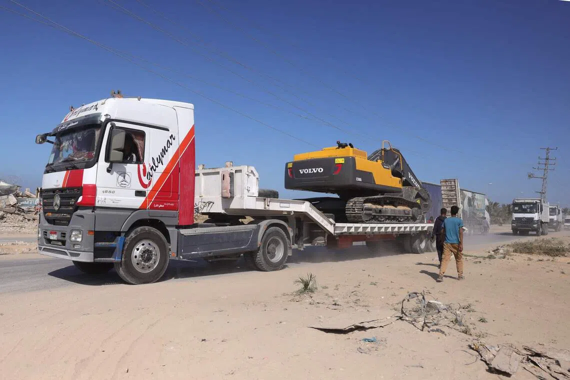 Heavy equipment being transported into the Gaza Strip on Oct 27 to help recover the remaining bodies of dead Israeli captives.