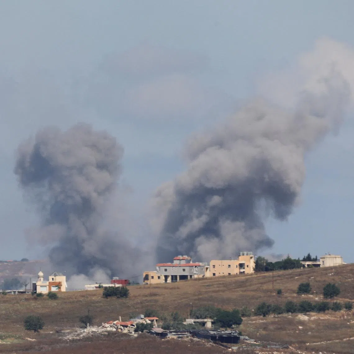 Smoke billows from southern Lebanon following an Israeli strike, as seen from Marjayoun, Lebanon, June 19, 2026. REUTERS/Stringer