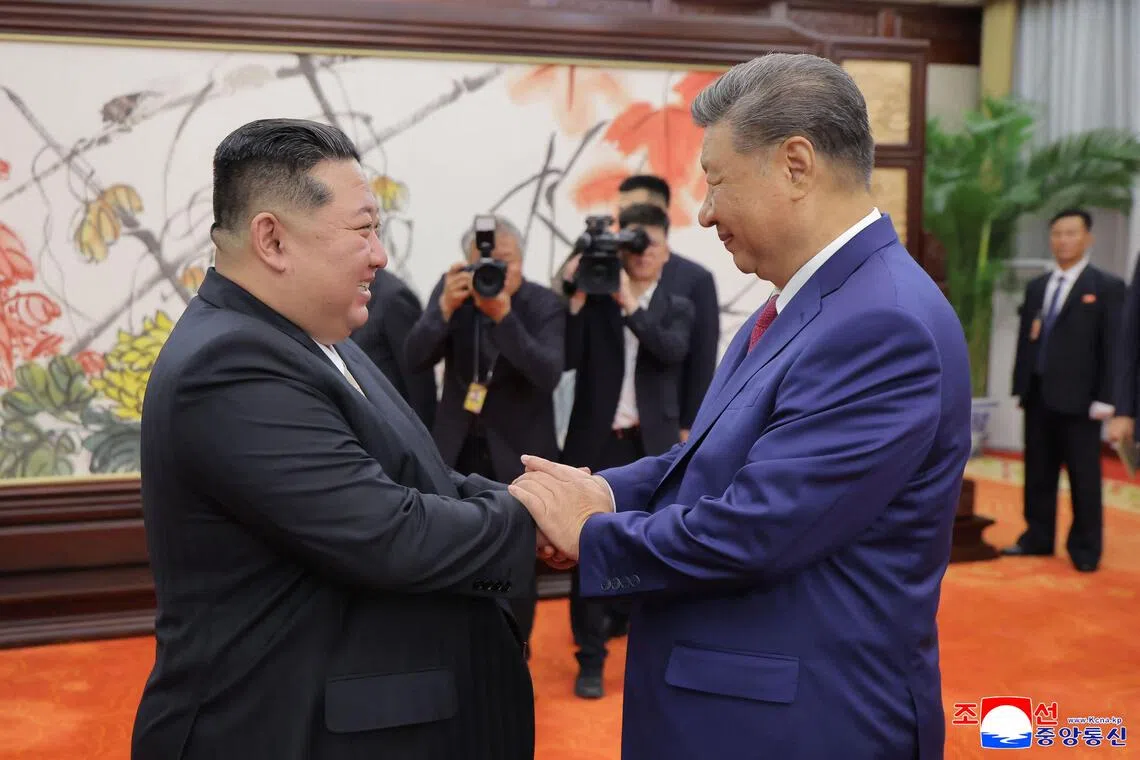 North Korean leader Kim Jong Un (left) shaking hands with Chinese President Xi Jinping in Beijing on Sept 4. 