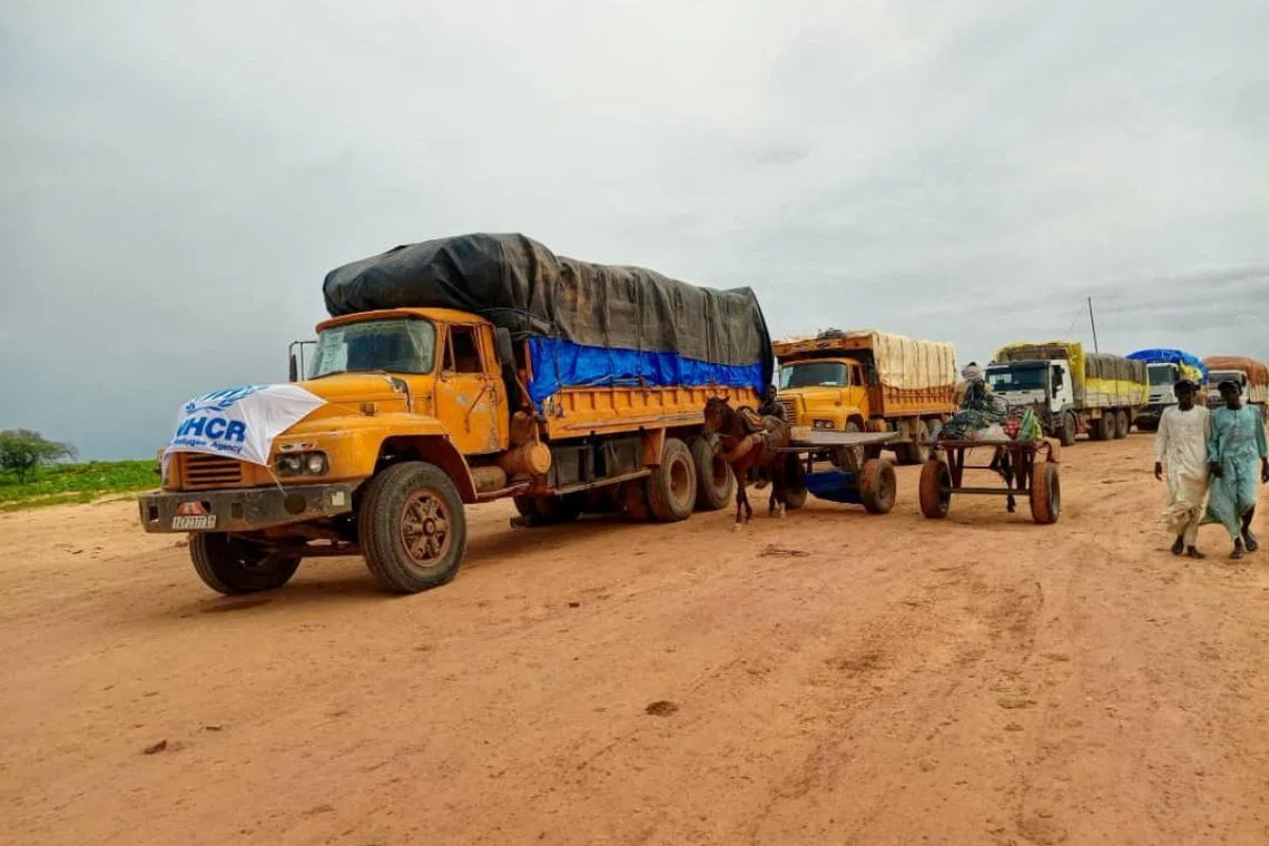 A handout image shows aid trucks with relief material for Sudan's Darfur region, at a location given as the border of Chad and Sudan, released on August 21, 2024. UNHCRinSudan via X/Handout via REUTERS/File Photo