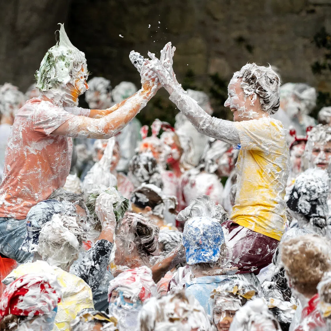 Students from St Andrews take part in a foam fight, as part of "Raisin Monday" in the Lower College Lawn, at St Andrews in Scotland, Britain, October 19, 2026. REUTERS/Lesley Martin
