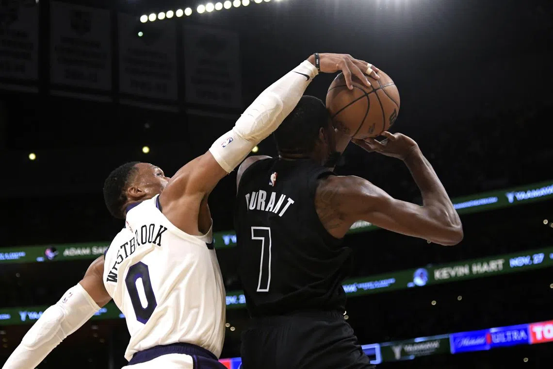 LA Lakers' Russell Westbrook blocking a layup by Brooklyn Nets' Kevin Durant in an NBA game on  Nov 13, 2022. Durant is headed for Phoenix Suns and Westbrook for Utah Jazz.