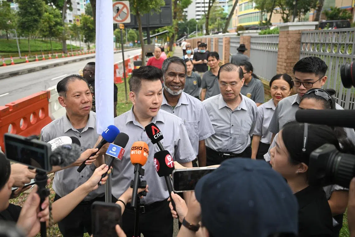 Singapore United Party secretary-general Andy Zhu speaking to the media outside Deyi Secondary School on April 23, 2025. With him are the party’s Ang Mo Kio GRC candidates (from his left) Ridhuan Chandran, Vincent Ng, Noraini Yunus and Nigel Ng. Mr Zhu and Ms Noraini contested in the GRC under the Reform Party banner in the 2020 General Election.