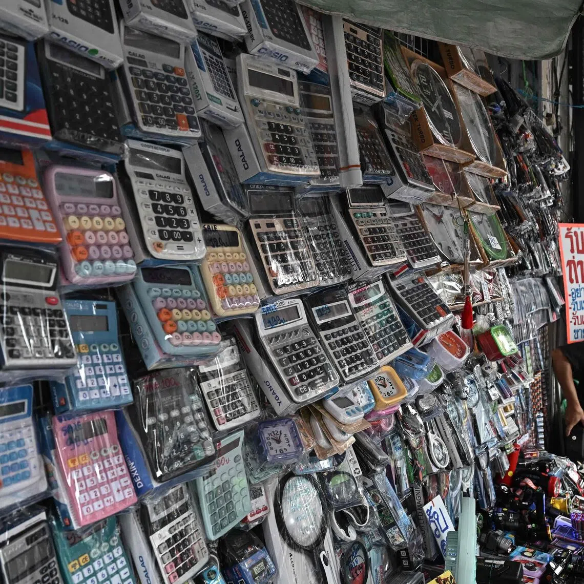 This photo taken on Nov 18 shows calculators for sale in a market in Bangkok. 